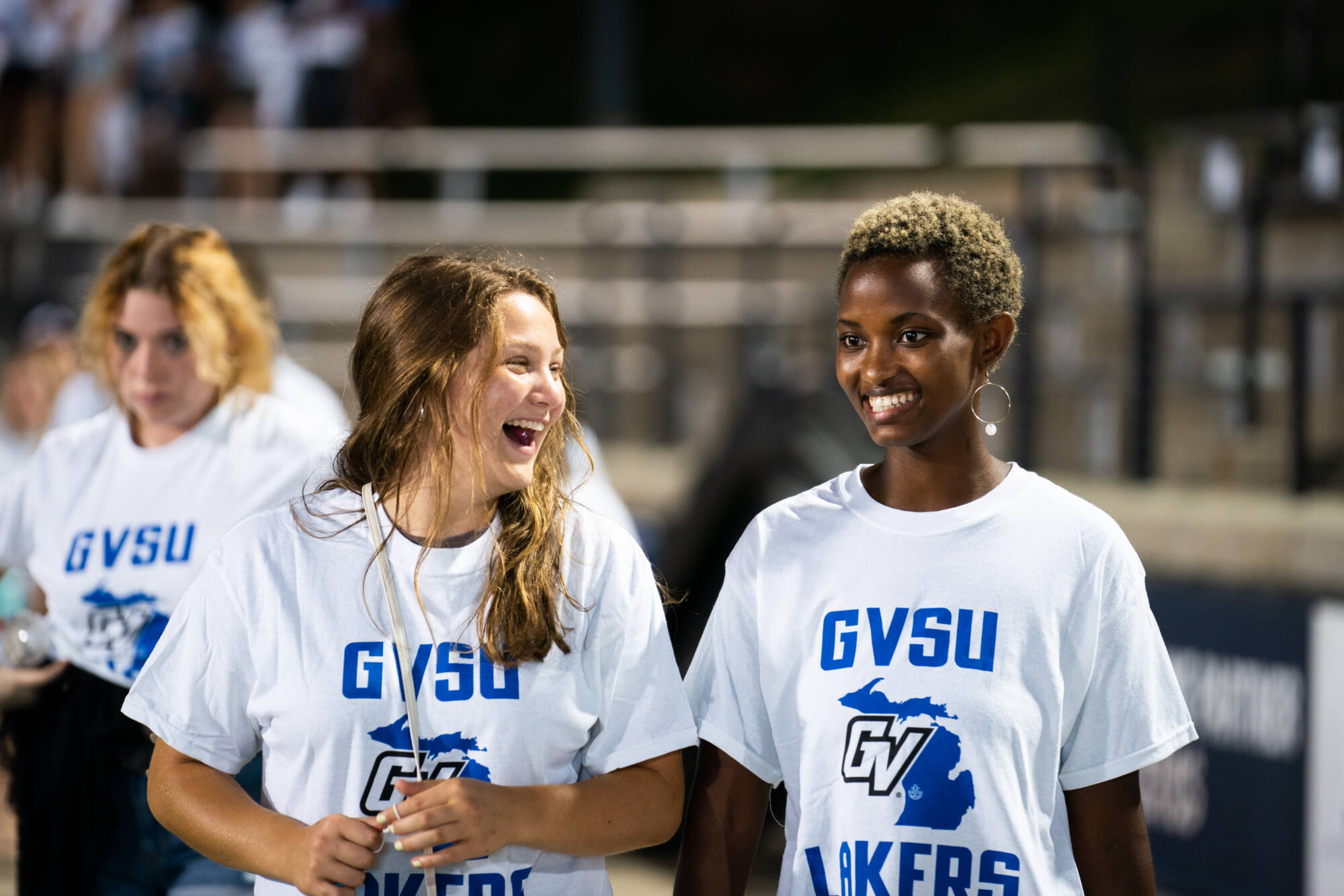 two high school students smiling
